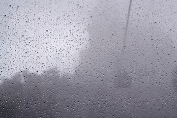 View of the cable car cabin in the fog through the glass in the raindrops