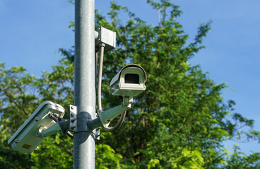 CCTV surveillance camera on pole in the park