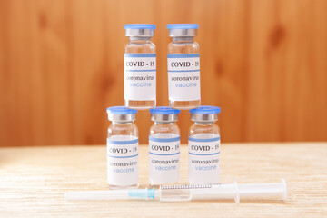 Vaccination covid-19 ampoules as a pyramid, coronavirus pandemic