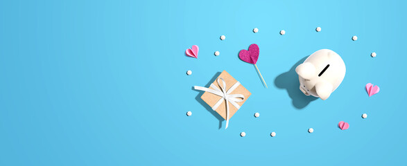 Piggy bank with a gift box and hearts