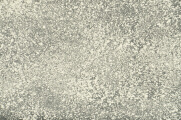many white dots and sand on a dark background.
abstract light drawing.