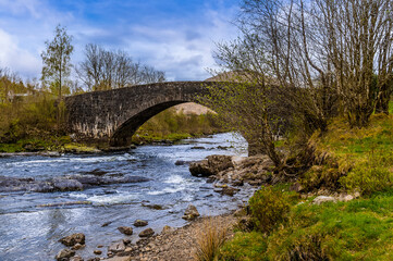 A view up the River Orchy towards the Eighteen century bridge near to Glencoe, Scotland on a summers day