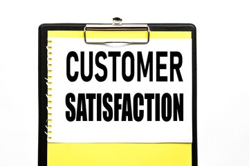 Customer Satisfaction Concept. text on white paper, on a yellow backing and colored on a white background