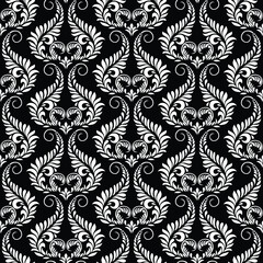 Wallpaper in Baroque style, damask. A seamless vector background. Black and white texture Floral ornament.