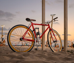 Fototapeta na wymiar Red retro trekking bike on the beach