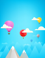 Color air balloons in a sky above mountains. Vectical composition with copy space
