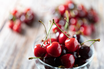 Obraz na płótnie Canvas close up to a bowl of cherries, summer fruits