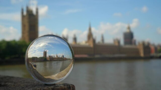 UK Houses of Parliament.
Parliament refracted in a glass sphere. Focus is on the refracted image. Shot from across the river.