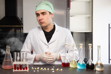 An experienced doctor is conducting an experiment in the laboratory. Viruses and scientific...