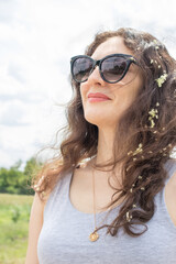 Beautiful brunette woman smiling in sunglasses with place for text. Glasses advertising, vertical photo.