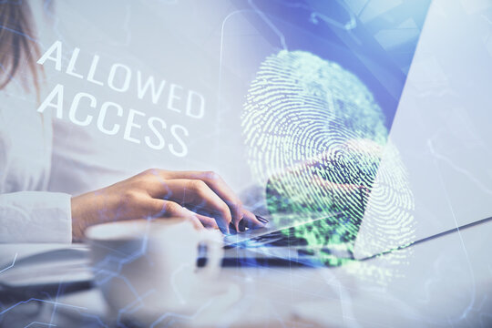 Double exposure of woman hands typing on computer and fingerprint drawing. Security concept.