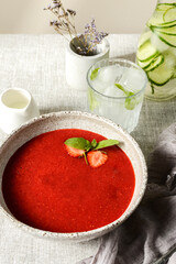 strawberry soup with cream on the table