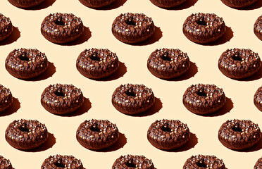 Pattern of donuts on yellow background