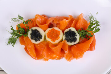 Sliced salmon with caviar