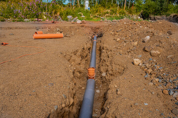 sewer pipe laid in a trench, preparation for the construction of the foundation