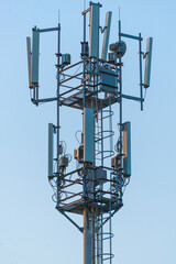 5G cell tower on the sky background