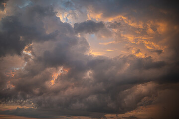 Fototapeta premium a dark thundercloud on the background of sunset