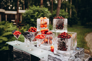 setting the wedding table with fruit in the garden