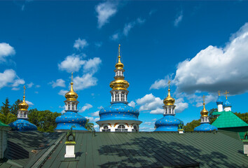 Fototapeta na wymiar The city of Pechora. Russia. Uspensky Pskov-Pechersk Monastery. The roof and domes of the Intercession Church, built over the Assumption Cave Church