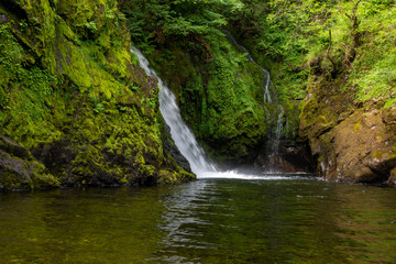 Ceunant Mawr waterfall  Wales. TDK are written in 'English'