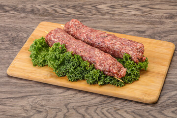 Raw minced beef kebab skewer