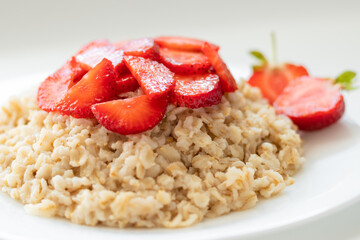 oatmeal with strawberries, healthy food, concept dietary food.
