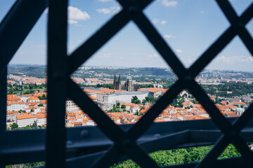 High observation deck through the lattice. Fenced observation deck on a beautiful city with streets on a sunny day.