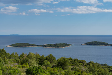 Fototapeta na wymiar Small Croatian forested islets near the island of Hvar seen from above
