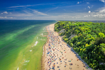 Crowded beach on Baltic Sea. Tourism in Poland by sea.