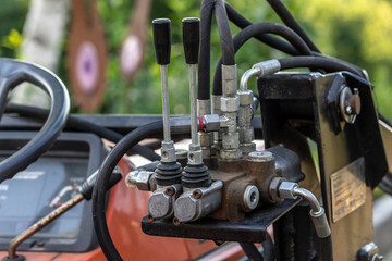 Close-up of hydraulic system mechanics of a mini truck