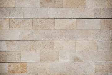 Grunge texture beige brick wall. Abstract background or texture.