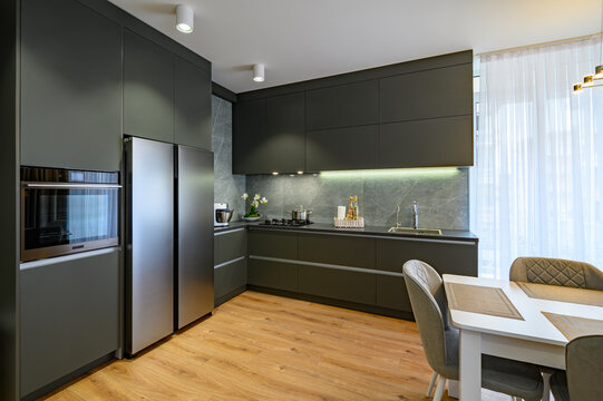 Modern large luxury dark gray kitchen