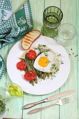 breakfast with fried eggs and vegetables