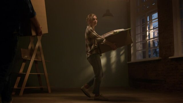 Joyful man relocating in new apartment. Man entering in renewed room.