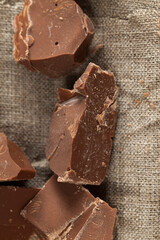 broken into several parts pieces of chocolate from cocoa
