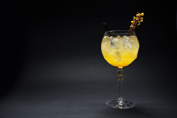 luxury gin hass orange cocktail drink with ice in glass on black background