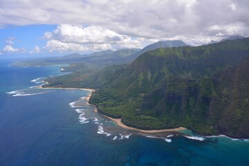 Fototapeta premium the coastline and coral reef around princeville, north kauai, hawaii, as seen from a helicopter