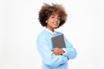 Fashion portrait of african american teen girl, high school or online course student holding...
