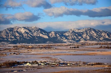 beautiful early morning view of the snowy front range and rock creek farm, from broomfield,...