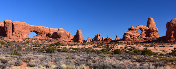 the eroded rock formations of north window arch   turret arch in arches national park, near moab, utah  © Nina