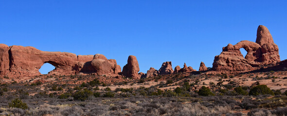 the eroded rock formations of north window arch   turret arch in arches national park, near moab, utah  © Nina