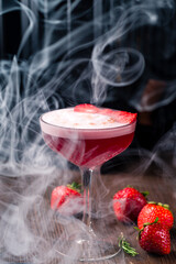 Red alcoholic Strawberry cocktail with ice cubes