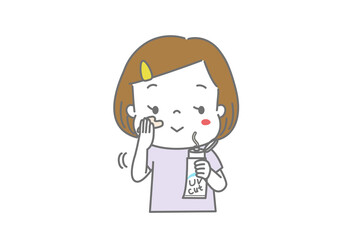 顔に日焼け止めクリームを塗る女の子