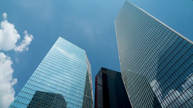 Business and finance concept, moody.  view looking up at modern office building architecture in the yeouido financial district, seoul,south korea.
