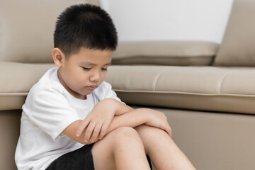Asian child  sitting alone with sad feeling, Concept for depression stress or frustration