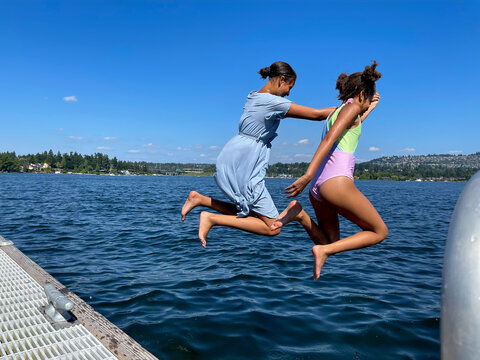 Kids jumping into the lake
