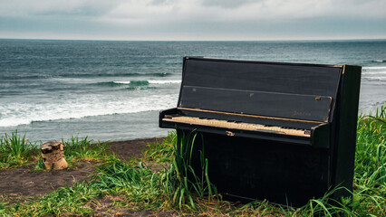 Kamchatka halaktyrsky beach. Piano on the shore of the Pacific Ocean