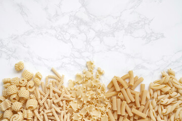 Five Varieties of Pasta on Marble Surface Horizontal