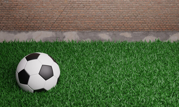 close up of 3d rendering soccer football put over green grass fields with red brick wall background. 3d illustration