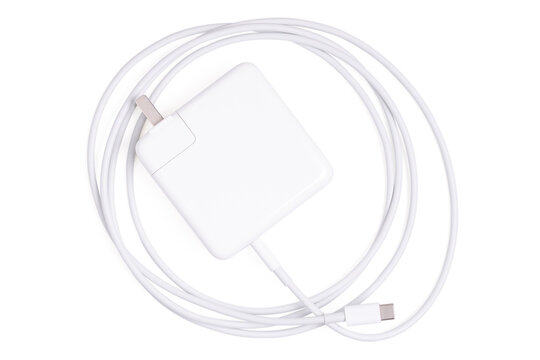 Top view Charger cord and plug for gadget on white.